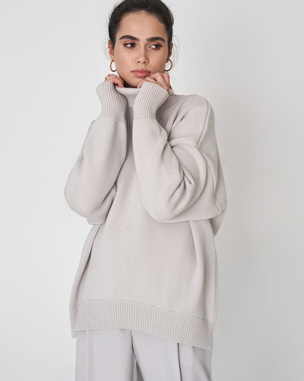Oversized Knit Blouse with High Neck Design