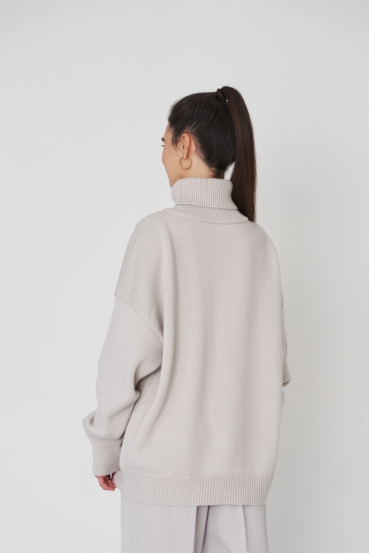 Oversized Knit Blouse with High Neck Design